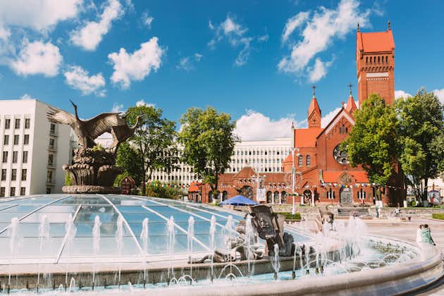 Photo of Church Of Saints Simon And Helen or Red Church And Fountain At Independence Square In Minsk, Belarus.