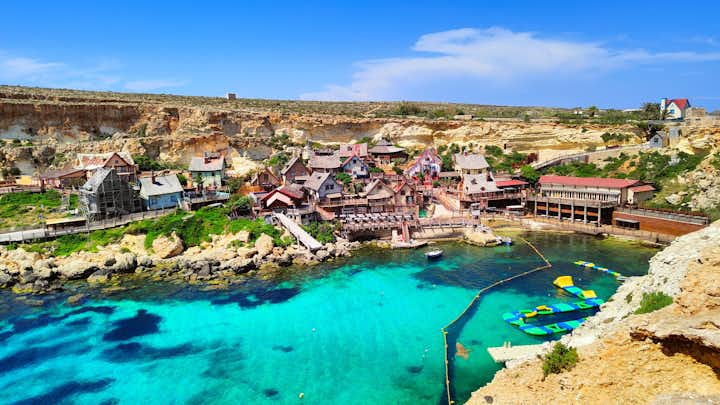 Photo of aerial view of famous Popeye village on a sunny day, Mellieha , Malta.