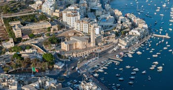 Aerial view of Lady of Mount Carmel church, St.Paul's Cathedral in Valletta embankment city center, Malta.