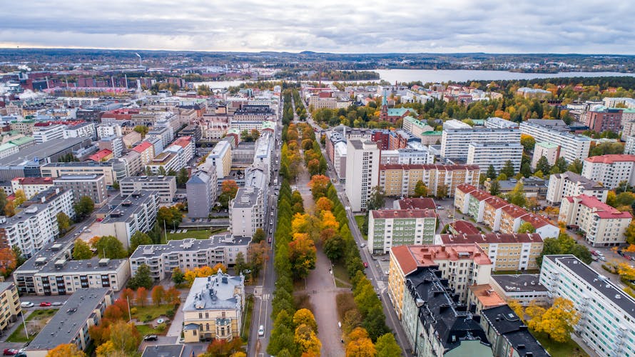 Photo of aerial autumn view of the Tampere city in autumn with colorful leaves.