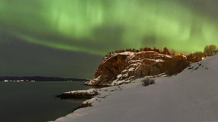 Aurora borealis captured in korsvika on cold night.