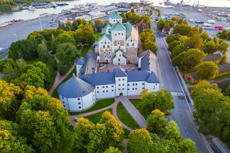 Photo of Middle ages fortress Turun linna . Aerial view of Turku Castle at evening sun.