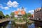View from the front of the Millers' Guild house and the Radunia Canal in Gdansk, Poland on a blue sky summer day