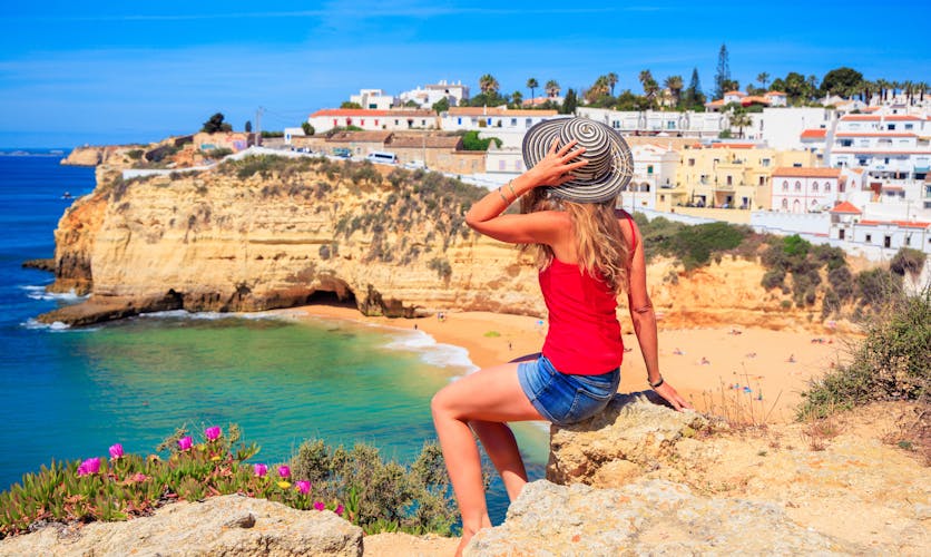 Photo of Woman tourist in Portugal beautiful beach and village, Faro.