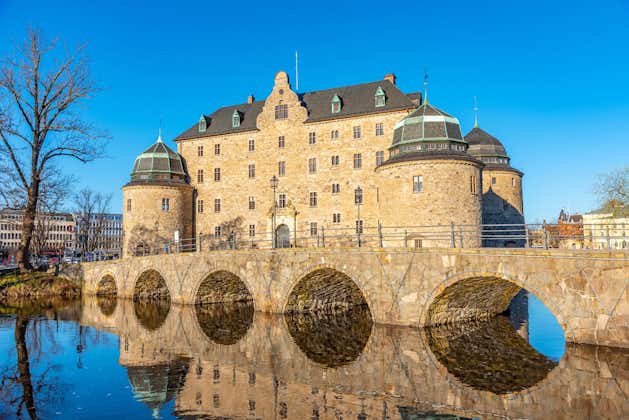photo of Örebro Castle and its reflection in water in Örebro County, Sweden. 