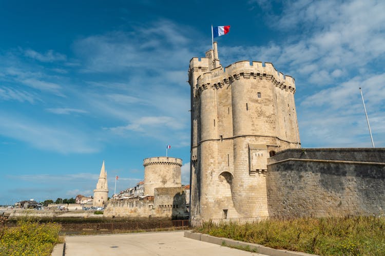 Photo of the beautiful fort and Saint Nicolas Tower of La Rochelle in summer.