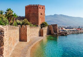 Photo of Kizil Kule or Red Tower and port aerial panoramic view in Alanya city, Antalya Province on the southern coast of Turkey.