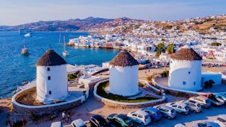 Photo of beautifull view over Mykonos from the sky with drone at the whitewashed village Greece.