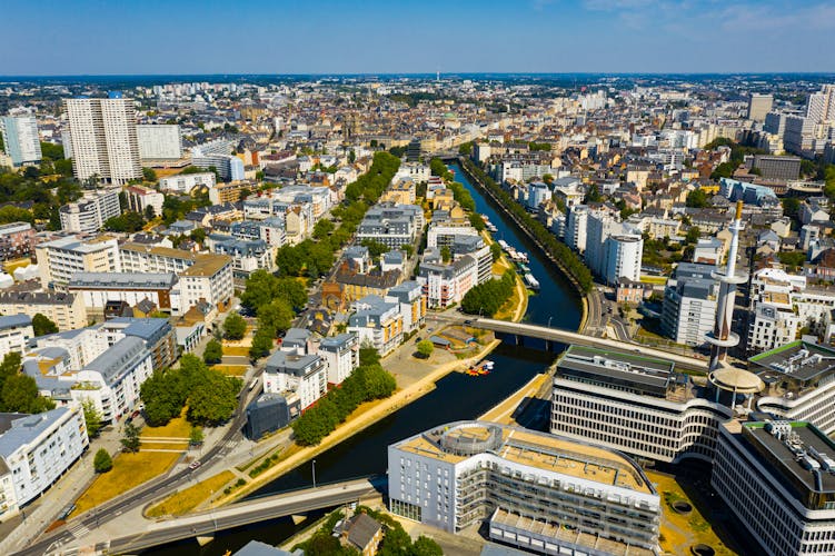 Photo of panoramic view of Rennes city with modern apartment buildings.