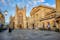 Photo of historic Bath Abbey and roman baths building in Bath Old town center, England.