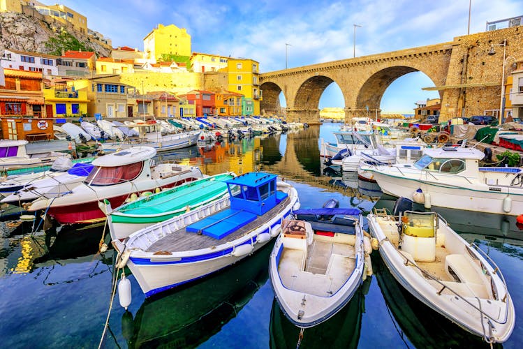 Photo of small fishing harbor Vallon des Auffes with traditional picturesque houses and boats, Marseilles, France.