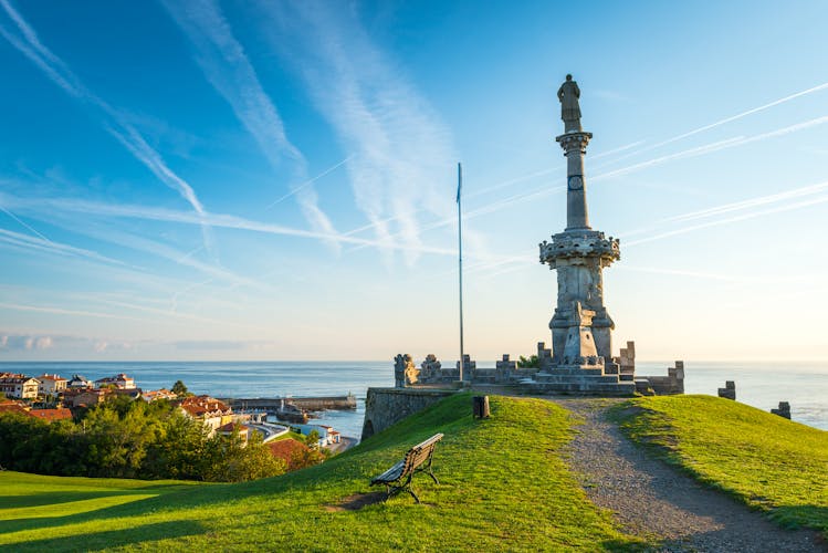 Photo of Comillas marquis monument facing the Cantabric sea and blue sky. province of Santander, Spain.