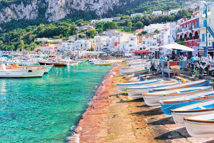 Photo of Boats at Marina Grande embankment in Capri Island in Tyrrhenian sea, Italy.