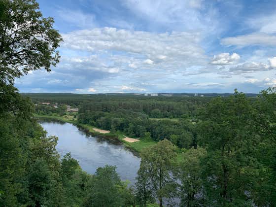 photo of neris river and forest. View from the observation area at verkiai regional park ( Verkiu parkas). Vilnius, Lithuania.