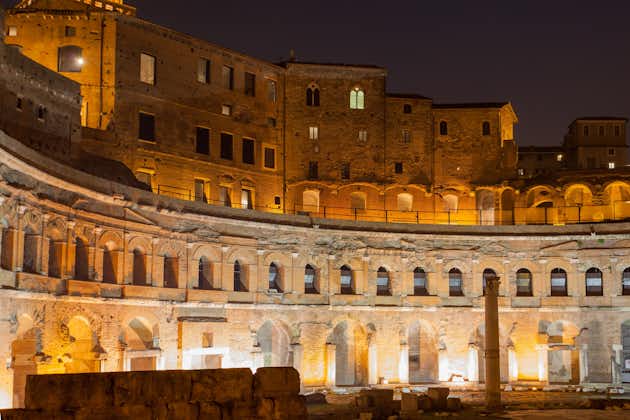 photo of Ruins of Trajan's Market at night, Rome, Italy .