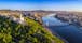 Photo of aerial panoramic skyline view of Budapest at sunrise. This view includes the Statue of Liberty, Elisabeth Bridge, Buda Castle Royal Palace and Szechenyi Chain Bridge with blue skyز