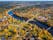 Photo of aerial view of The Ogre River, Bridges and Houses in the Autumn Time, Ogre, Latvia.