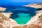 Photo of crystal clear turquoise water in blue lagoon of St. Peters pool  rocky beach at Malta.