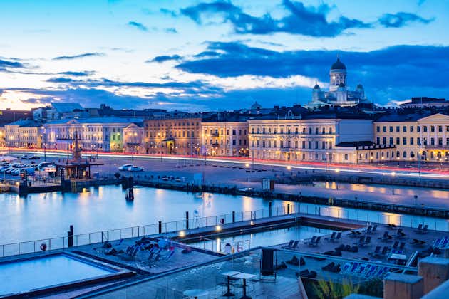 Photo of Evening panorama of the capital of Finland, outdoor pool in the southern harbour of Helsinki and ,market square, Helsinki, Finland. 