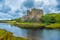 Photo of Dunvegan Castle on the Isle of Skye, Highlands of of Scotland. Seat of the MacLeod Clan. Built on an elevated rock overlooking an inlet on the eastern shore of the sea Loch of Dunvegan.