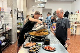 Seafood Paella cooking class, tapas and visit market