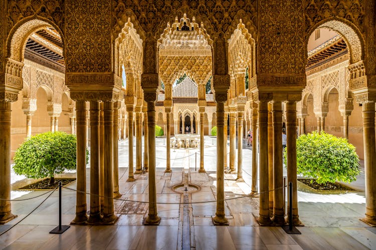 Photo of court of the Lions Nasrid Palaces of Alhambra palace complex, Granada, Spain.