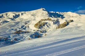 photo of an aerial view of winter landscape and ski resort in the Alps, La Toussuire, France, Europe.
