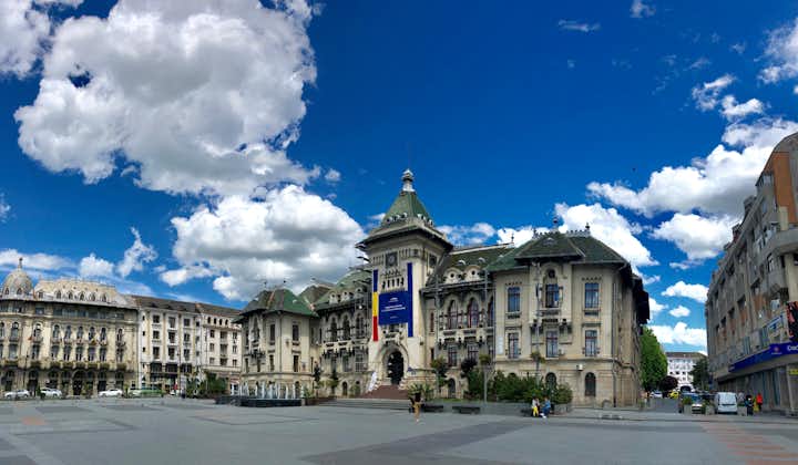 Photo of Administrative Palace from Craiova Romania during summer sunny day with blue sky and white clouds.