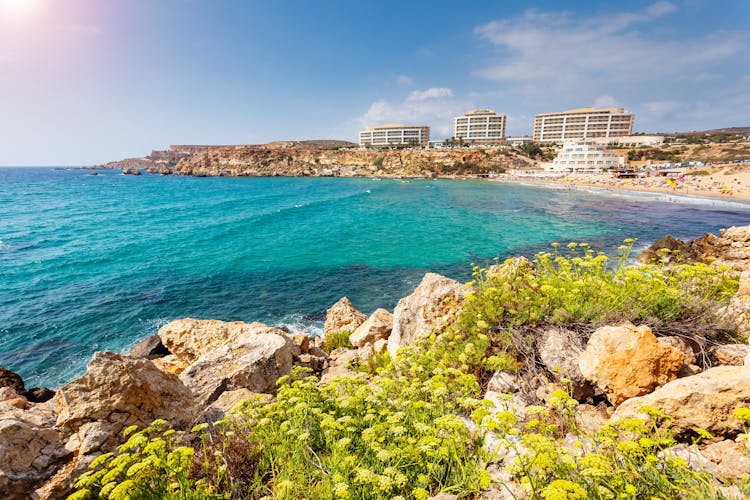 Photo of blue beach water of Manikata, Malta.