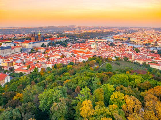 Photo of Prague city panorama with castle, Lesser Town and Vltava River view from Petrin lookout tower, Czech Republic.