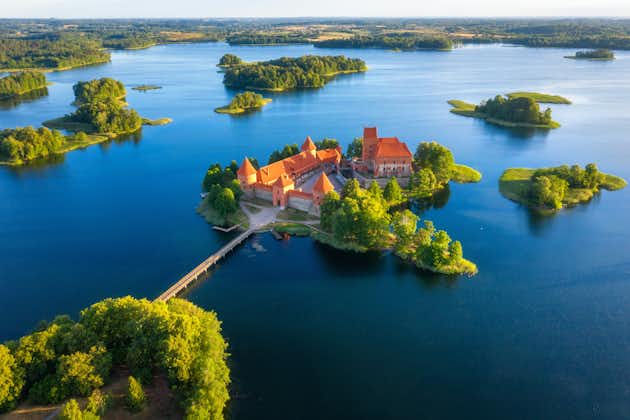 photo of trakai castle in lithuania aerial view. Green islands in lake in trakai near vilnius. Trakai drone view.