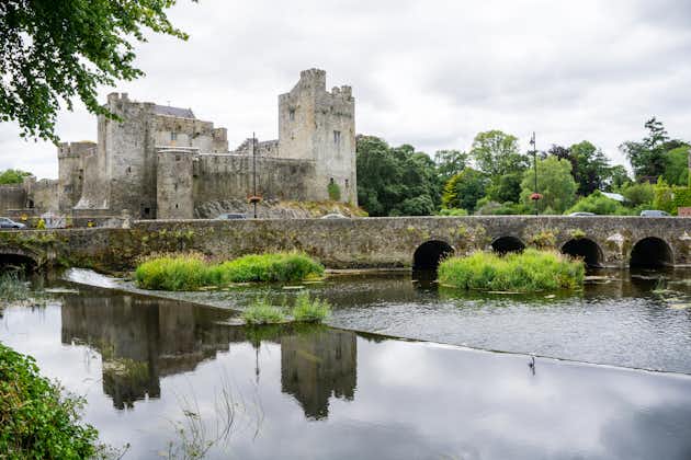 photo of Cahir Castle with water reflection in Ireland .