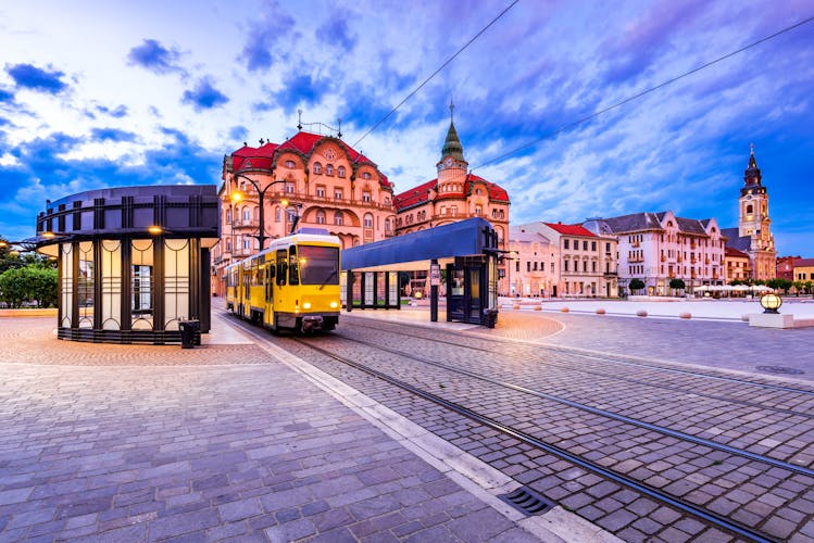 Oradea, Transylvania with tram station in Union Square cityscape in Romania.