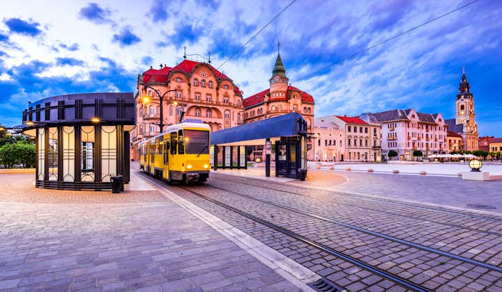 Oradea, Transylvania with tram station in Union Square cityscape in Romania.