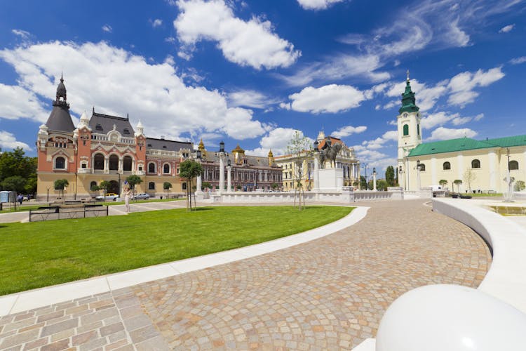 Union square (Piata Unirii) Oradea, Romania, cityscape with beautiful clouds.