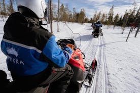 Snowmobiling and ice fishing in Apukka Resort, Rovaniemi