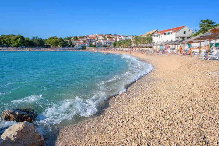 Photo of beautiful beach in Primosten town, Sibenik Knin County, Croatia.