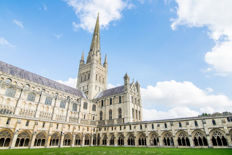 Photo of Norwich cathedral on a sunny day in Norwich, Norfolk, England.