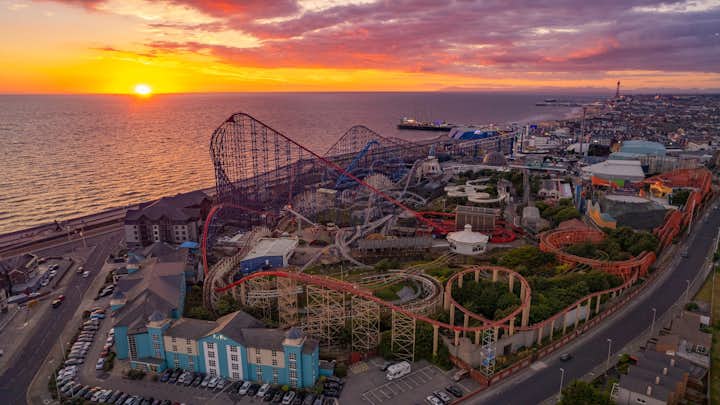 Photo of sunset on pleasure beach in Blackpool in the United Kingdom by Mark mc neill