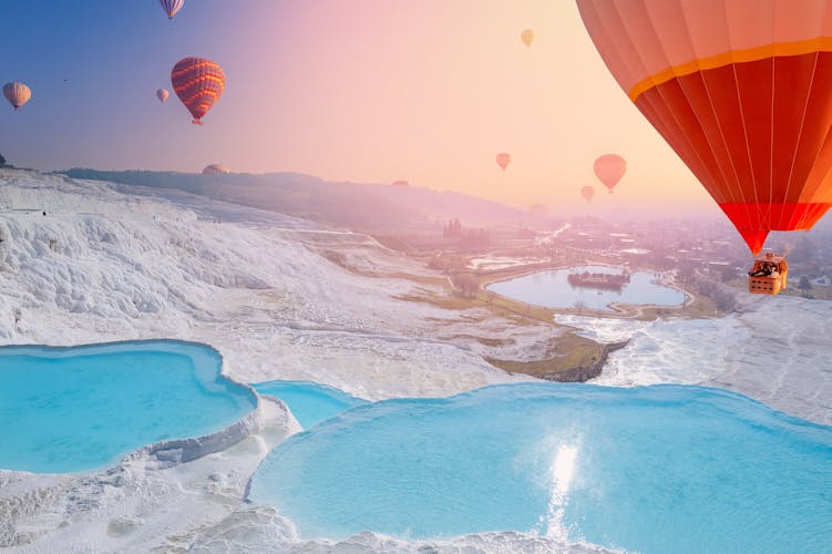 Photo of hot air balloon flying Travertine pool and terraces sunset, Denizli.