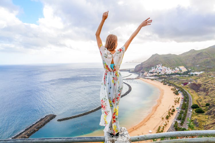Photo of traveler girl enjoying the beach of Las Teresitas and San Andres village, Tenerife, Canary Islands, Spain. 