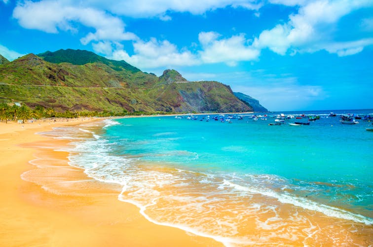 Photo of beautiful sandy beach in Tenerife with blue sky, Canary Islands, Spain.
