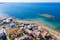 Photo of aerial view of Malia beach and small island with Church of Transfiguration, Heraklion, Crete, Greece.