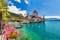 photo of Oberhofen Castle at Lake Thunersee in swiss Alps, Switzerland. Schloss Oberhofen on the Lake Thun (Thunersee) in Bern Canton of Switzerland. Oberhofen castle on Lake Thun, Switzerland.