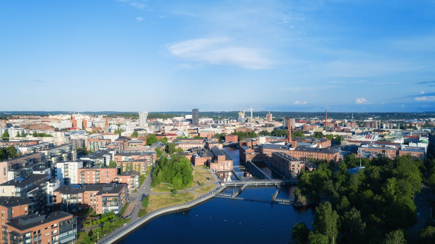 Photo of aerial view of the Tampere city at sunset.