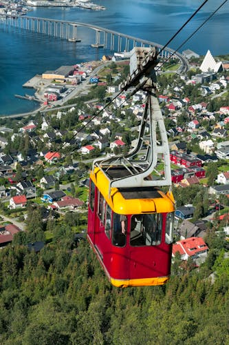 Photo of cable car above Tromso city with the bridge and Arctic Cathedral on background, Norway