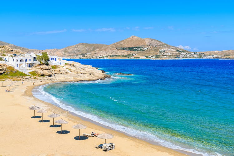 Photo of beautiful bay with beach in Naoussa village, Parikia ,Paros island, Cyclades, Greece.