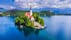 Bled, Slovenia. Amazing Bled Lake, island and church with Julian Alps mountain range background, Europe spotlight.