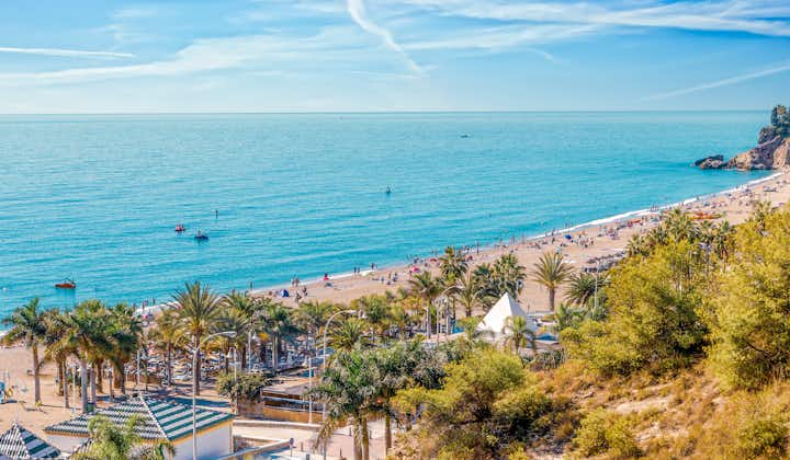 Photo of Playa Burriana at Nerja, Costa del Sol, Malaga. Very popular beach with tourists from all over.