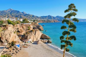 Photo of aerial view of the town of Nerja with the beautiful beach, Málaga, one of the white villages of Andalusia, Spain.